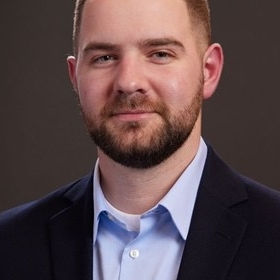 Headshot of professional man in formal attire