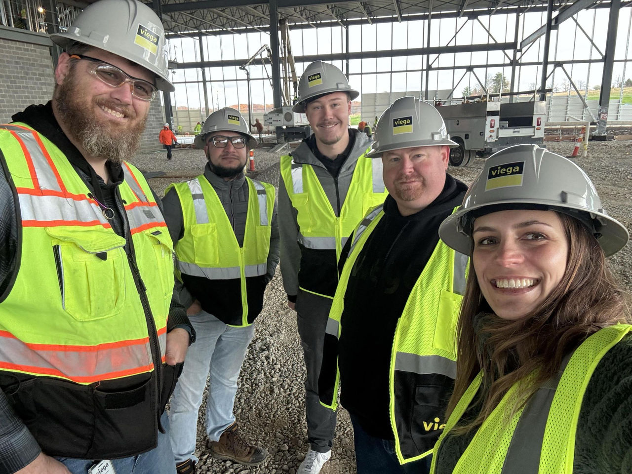 Crew of five people on a construction site