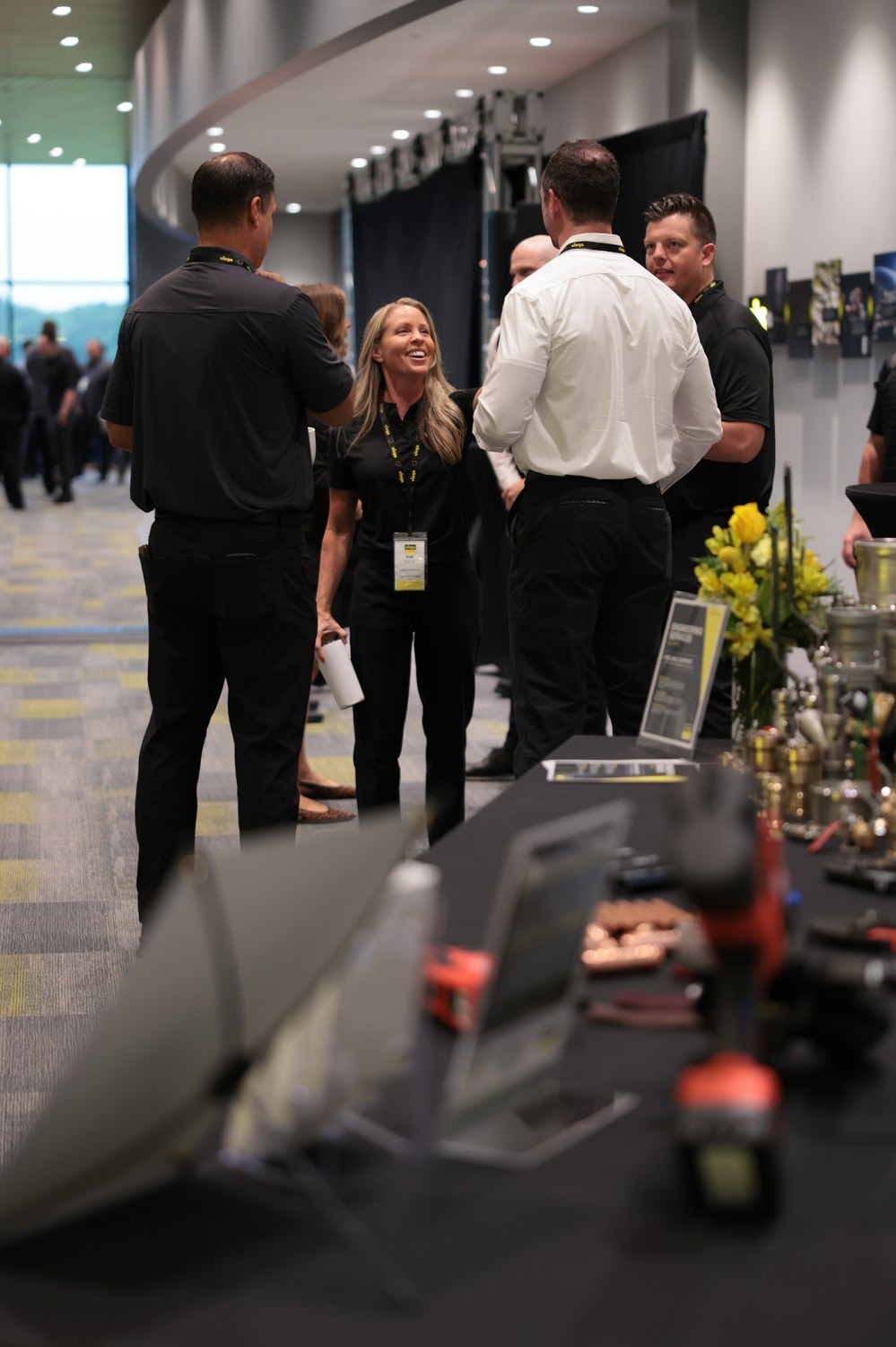 Product display table and Viega guests at the Ohio ribbon-cutting event.